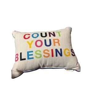 This is a "Count Your Blessings" decorative pillow from the brand Novogratz.